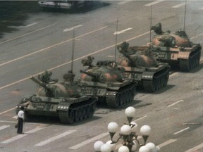 In this now-iconic June 5, 1989 file photo, a man stands alone to block a line of tanks heading east on Beijing's Changan Blvd. from Tiananmen Square in Beijing.