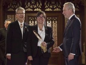 A committee of senators has approved a number of changes to a bill that aims to end solitary confinement in Canadian prisons -- including one key change that would place a 48-hour maximum on the amount of time an inmate can be kept in isolation. Kim Pate, centre, stands with Senators Peter Harder and Senator Lillian Eva Dyck before being sworn in during a ceremony in the Senate, in Ottawa, Tuesday, Nov. 15, 2016.