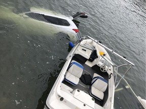 A man escaped with minor injuries after narrowly being crushed by a vehicle and boat at Rocky Point Park in Port Moody Wednesday.