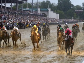 Luis Saez rides Maximum Security across the finish line first followed by Flavien Prat on Country House during the 145th running of the Kentucky Derby horse race at Churchill Downs Saturday, May 4, 2019, in Louisville, Ky. Country House was declared the winner after Maximum Security was disqualified following a review by race stewards.