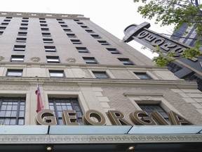 Staff at Vancouver's upscale Rosewood Hotel Georgia remain on strike, despite a deal at four other downtown hotels.
