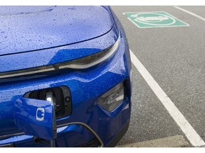 A 2020 Kai Soul EV charges at one of three EV charging stations by the Hillcrest Aquatic Centre in Vancouver.