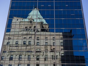The Hotel Vancouver is reflected in a nearby office building on May 22, 2019.