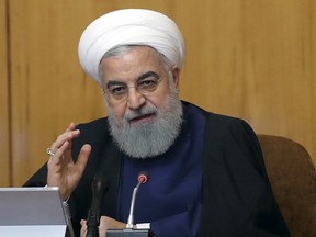 In this photo released by the official website of the office of the Iranian Presidency, President Hassan Rouhani speaks in a cabinet meeting in Tehran, Iran, Wednesday, May 8, 2019. Rouhani said Wednesday that it will begin keeping its excess uranium and heavy water from its nuclear program, setting a 60-day deadline for new terms to its nuclear deal with world powers before it will resume higher uranium enrichment.