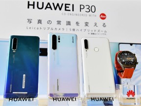 In this May 21, 2019, photo, Huwaei's new products are on display during a news conference in Tokyo.