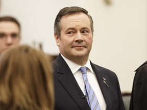 Alberta Premier Jason Kenney watches as members are sworn in at the Alberta Legislature in Edmonton on May 21, 2019.