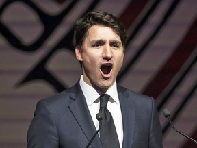 Prime Minister Justin Trudeau jokes around after finishing his speech at the annual Press Gallery dinner in Gatineau, Que., on May 4, 2019.