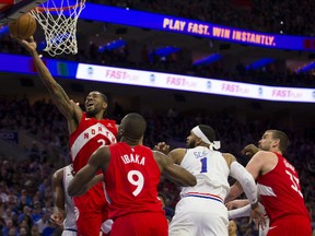 Kawhi Leonard #2 of the Toronto Raptors attempts a layup past Mike Scott #1 of the Philadelphia 76ers in the second quarter of Game Four of the Eastern Conference Semifinals at the Wells Fargo Center on May 5, 2019 in Philadelphia.