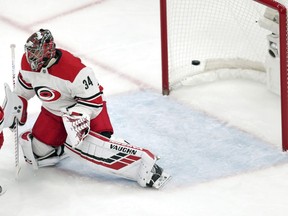 Carolina Hurricanes goaltender Petr Mrazek (34), of the Czech Republic, drops to a knee as a shot by Boston Bruins' Steven Kampfer goes past for a goal during the first period in Game 1 of the NHL hockey Stanley Cup Eastern Conference finals Thursday, May 9, 2019, in Boston.