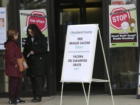 Signs about measles and the measles vaccine are displayed at the Rockland County Health Department in Pomona, N.Y., Wednesday, March 27, 2019.