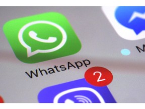 FILE - This Friday, March 10, 2017, file photo shows the WhatsApp communications app on a smartphone, in New York. WhatsApp says a vulnerability in the popular communications app let mobile phones be infected with sophisticated spyware with a missed in-app call alone.