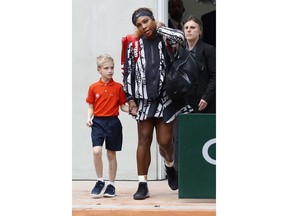 Serena Williams of the U.S. enters center court for her first round match of the French Open tennis tournament against Vitalia Diatchenko of Russia at the Roland Garros stadium in Paris, Monday, May 27, 2019.