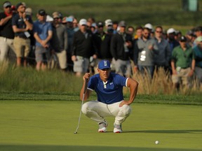 Brooks Koepka lines up a putt on the 17th green during the second round of the PGA Championship golf tournament, Friday, May 17, 2019, at Bethpage Black in Farmingdale, N.Y.
