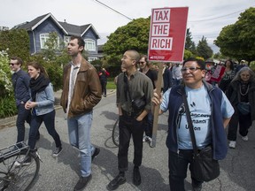 About 100 people marched through Point Grey near Jericho Beach for Saturday's
Billionaire Bash, protesting housing prices and land speculation and how those factors affect affordability in Vancouver.