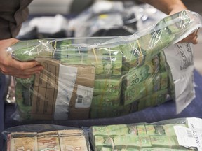 Cash seized in 2017 during an illegal gambling and money laundering investigation in British Columbia. A recent report on money laundering in B.C. estimated more money is laundered in Alberta than anywhere else in Canada each year. The estimates have been met with skepticism.