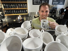 Chris Hannah, Trees Organic Coffee's director of operations, with a ceramic mug. Vancouver is considering ways to reduce the number of single-use items being thrown in the trash, particularly coffee cups, takeout containers and shopping bags.
