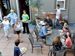 Members eat dinner in the court yard of the Cranberry Commons Co-housing development in Burnaby in 2008. Co-housing is viewed by some as one solution to Vancouver's housing crisis. (Sam Leung/PNG FILES)