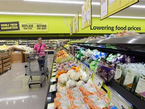 A woman shops at the new FreshCo store in Mission, the first of a dozen shops under that banner promised by Sobeys Inc. by the end of this year in an effort to grow market share in the west following a years-long fallout from its troubled acquisition of the Safeway chain.