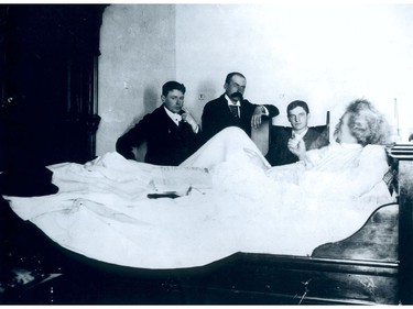 American author Mark Twain (lying down) talks to three newspaper reporters in his room at the (first) Hotel Vancouver in this Aug. 16, 1895 archival photo. Twain was in town to deliver a lecture, but was prevented from speaking because of bronchitis, so he consented to the interview.