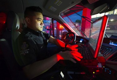 Transit Police Sgt. Const. Darren Chua works on a police report after attending a call near Surrey Central station.