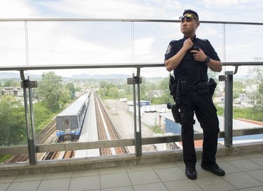 Transit Police Const. Darren Chua stands at the entrance to the Sapperton Skytrain station.