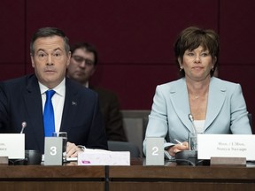 Alberta Premier Jason Kenney and Minister of Energy for Alberta Sonya Savage, right, prepare to appear at the Standing Senate Committee on Energy, the Environment and Natural Resources about Bill C-69 at the Senate of Canada Building on Parliament Hill in Ottawa on Thursday, May 2, 2019.