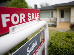 A real estate sign is pictured in Vancouver, B.C., Tuesday, June 12, 2018.