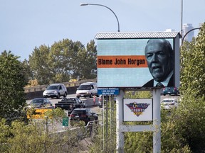 Motorists travel over the Alex Fraser Bridge as an electronic billboard paid for by the B.C. Liberal caucus, placing blame for high gas prices on Premier John Horgan is seen in Delta on Saturday May 4, 2019.