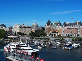 The Empress (boat) pulls into it's Inner Harbour berth with the Fairmont Empress (hotel) providing a stately welcome.