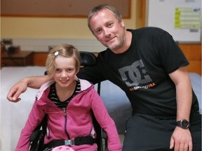 Chris Walton with daughter Micaela at the Sunny Hill Health Centre for Children in Vancouver. The 10-year-old is recovering from carbon monoxide poisoning afrter an incident in a tent while camping at Sandy Point Beach in the Shuswap on the Victoria Day long weekend. Micaela's mom, Lucille Beaurain, died after the tent filled with CO after a stove was used to heat the inside of the tent.