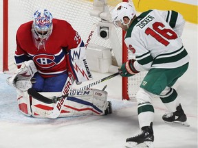 MONTREAL, QUE.: NOVEMBER 9, 2017 -- Montreal Canadiens goalie Charlie Lindgren stops shot by Minnesota Wild's Jason Zucker (16) during third period NHL action in Montreal on Thursday November 9, 2017. (Pierre Obendrauf / MONTREAL GAZETTE) ORG XMIT: 59700 - 1069