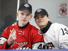 Bowen Byram (L) and Alex Turcotte pose for a photo following a top prospects clinic prior to the NHL draft at Hillcrest Community Centre on June 20, 2019 in Vancouver.