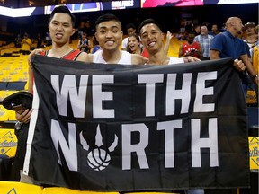 Toronto Raptors fans pose in the stands before Game Three of the 2019 NBA Finals against the Golden State Warriors at Oracle Arena on June 05, 2019 in Oakland, California. Photo: Lachlan Cunningham/Getty Images