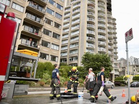 Vancouver firefighters work to contain an apartment fire in the West End on Sunday, June 2nd.
