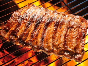 Barbecuing pork ribs.