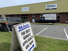 Vancouver police say charges have been laid in the suspicious death of John McIver at his appliance store in East Vancouver. McIver was found dead in the shop.