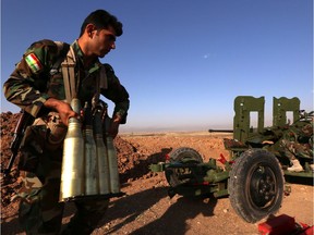 An Iraqi Kurdish Peshmerga fighter prepares ammunitions on the front line near Hasan Sham village, some 45 kilometres east of the city of Mosul, during an operation aimed at retaking areas from the Islamic State group in 2016.