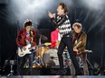 Ronnie Wood (left), Mick Jagger (centre), Charlie Watts (partially hidden) and Keith Richards of the Rolling Stones perform as they resume their "No Filter Tour" North American Tour at the Soldier Field in Chicago.