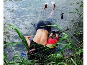 View of the bodies of Salvadoran migrant Oscar Martinez Ramirez and his daughter, who drowned while trying to cross the Rio Grande -on their way to the US- in Matamoros, state of Tamaulipas on June 24, 2019.