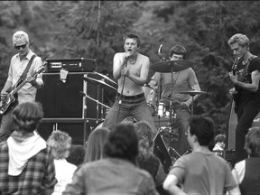 The Subhumans play at the Anti -Canada Day concert in Stanley Park on July 1 1978. Left to right: bassist Gerry Useless (aka Gerry Hannah), drummer Ken "Dimwit" Montgomery, singer Wimpy Roy (Brian Goble), and guitarist Mike Normal (Mike Graham). Ian Lindsay / Vancouver Sun