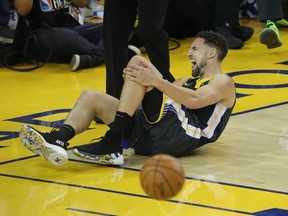 Golden State Warriors guard Klay Thompson (11) reacts after being fouled by Toronto Raptors guard Danny Green (14) during the second half in Game 6of the 2019 NBA Finals at Oracle Arena.