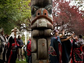 Women dance during the Abyas song to cleanse and bless the ground for the cedar mortuary pole replica carved by Mungo Martin in 1955 was removed from Thunderbird Park during a commemorative ceremony on the grounds of the Royal B.C. Museum in Victoria, B.C., on Wednesday, June 5, 2019.