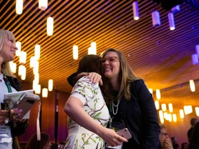 Lauren Dobson-Hughes of LDH Consulting is hugged by Jocelyn Mackie of Grand Challenges Canada as they react to an announcement of a $1.4 billion annual commitment to support women's global health by Prime Minister Justin Trudeau at the Women Deliver 2019 Conference at the Vancouver Convention Centre on June 4, 2019.