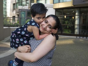 VANCOUVER May 30 2019.  Kartiki Deshpande and her daughter Nova play in front of their building, Vancouver May 30 2019.  Kartiki is searching for daycare for Nova. ( Gerry Kahrmann  /  PNG staff photo) 00057543A   Story by Dan Fumano [PNG Merlin Archive]