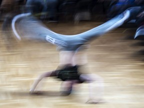 In this file picture taken with a long time exposure on March 12, 2017, Jannis Bednarzik performs during the German Breakdance Championships in Magdeburg, Germany. Canadian breakdancers are expressing mixed feelings about the danceform moving closer to becoming an Olympic sport, with some enthusiastic about the possiblity and others concerned it may alter the underground culture around the activity.