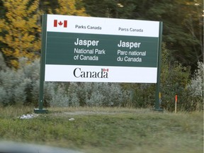A sign is posted just west of the Jasper National Park gates on highway #16 on Wednesday Oct. 1, 2013. Tom Braid/Edmonton Sun/QMI Agency