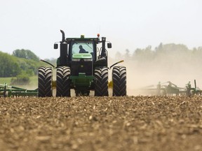 Canadian farmers' net income plummeted 21 per cent last year to $11.6 billion due to soaring debt and labour costs, marking the lowest income level in seven years.