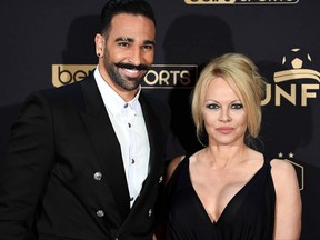 Marseille's defender Adil Rami and actress Pamela Anderson arrive to take part in a TV show on May 19, 2019 in Paris, as part of the 28th edition of the UNFP (French National Professional Football players Union) trophy ceremony. (FRANCK FIFE/AFP/Getty Images)