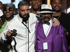 Recording artist Drake (L) accepts the Top Artist award with his father Dennis Graham during the 2017 Billboard Music Awards at T-Mobile Arena on May 21, 2017 in Las Vegas, Nevada.