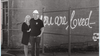 Cheryl and Dwayne Nadeau pose next to a work by local artist Wendy Williams Watt.